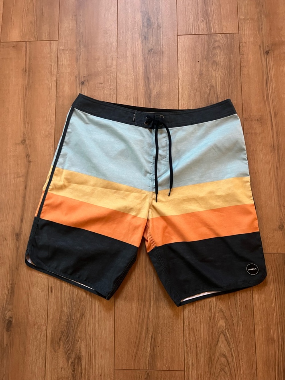 O'Neill Colorblock Board Shorts in Light Blue, Yellow, Orange, and Black